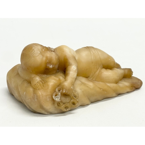 51 - A 19th century Alabaster ‘Sleeping Cupid’ 13x6cm