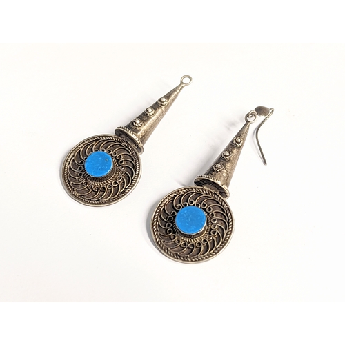 353 - A pair of ornate silver earrings