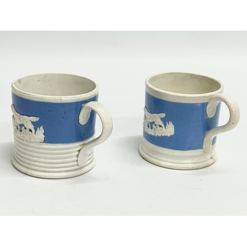 103 - A pair of early to mid 19th century mugs. 10x7cm