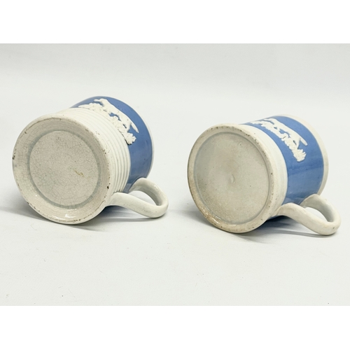 103 - A pair of early to mid 19th century mugs. 10x7cm