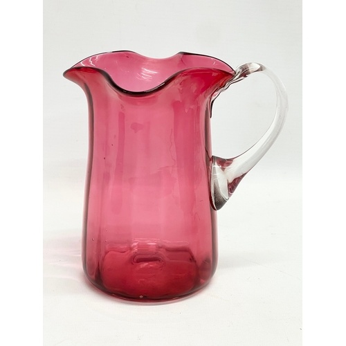 105 - 3 pieces of late 19th century Cranberry and Ruby Glass. Jug measures 14x15cm