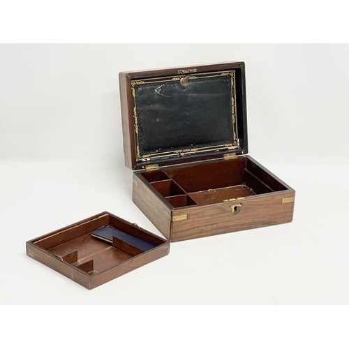 113 - A Victorian rosewood brass bound stationary box. 29.5x22x12cm