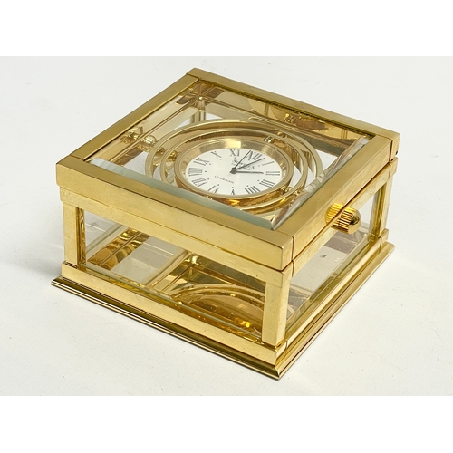 181 - A good quality Sewills ‘Ark Royal’ brass desk clock with box. Clock measures 9x8.5x5cm