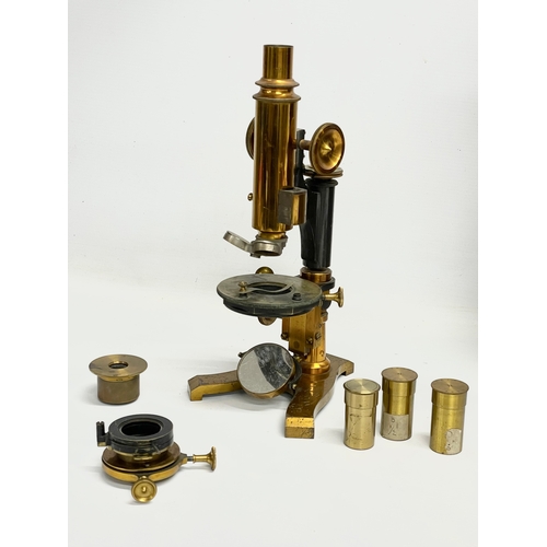 57 - A vintage J Lizars Monocular brass opticians microscope in case.