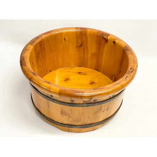 192 - A Chinese Yew Wood foot bath. By Muzhiyun. 40x21cm