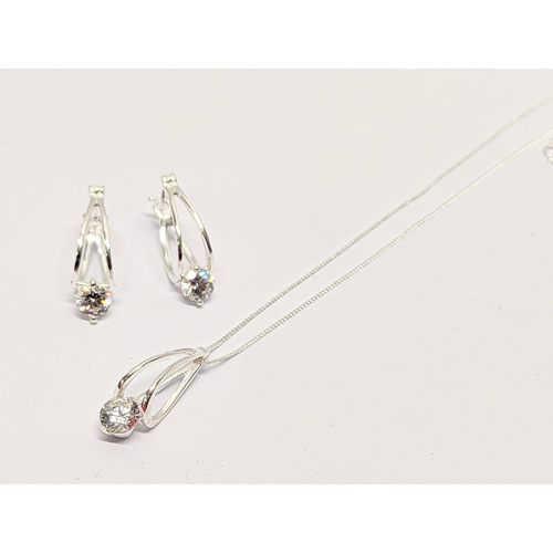 391 - A silver necklace and earring set