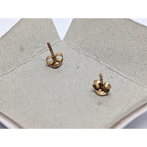 408 - A pair of small 9ct gold and pearl earrings