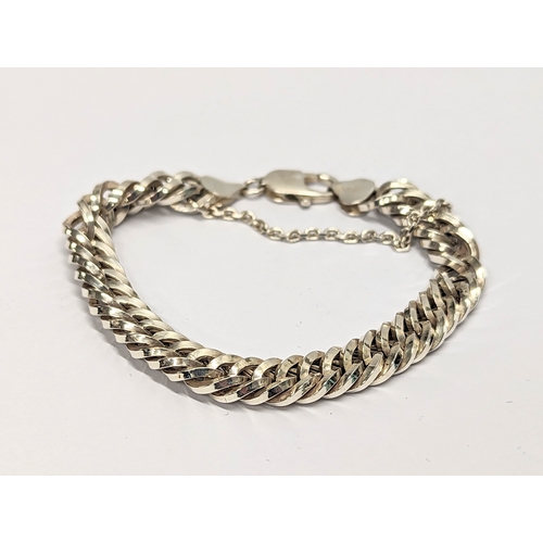 412 - A silver bracelet. 13.4g