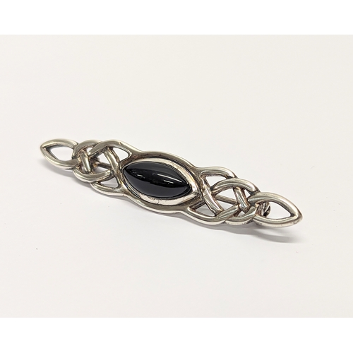 415 - An ornate silver brooch