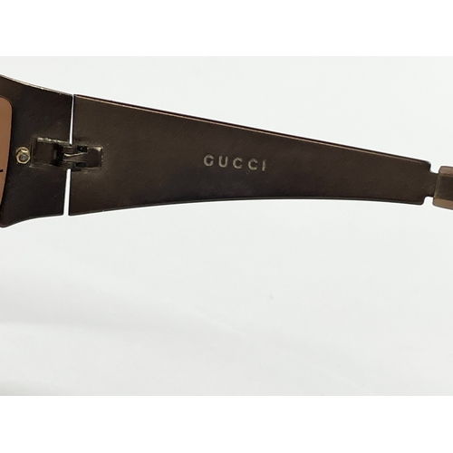 417 - A pair of Gucci sunglasses.