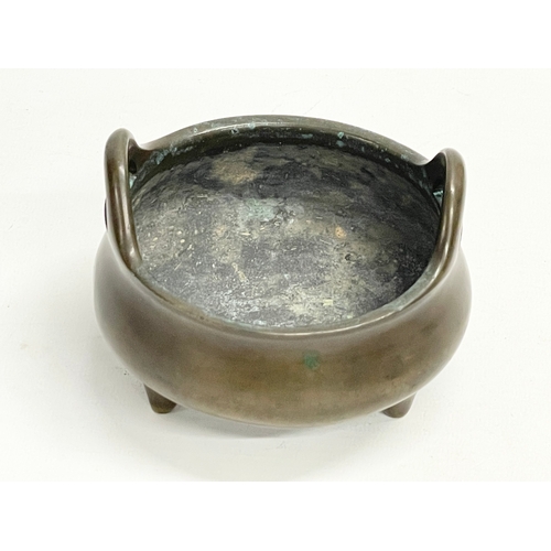 153 - A late 19th century Chinese bronze censer. 11x11x8cm