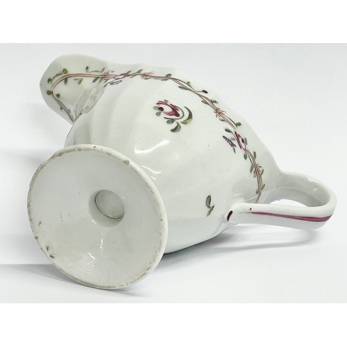 154 - A late 18th century New Hall ‘Pink Ribbons’ porcelain cream jug. Circa 1790. 13x6x10cm