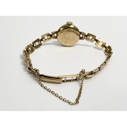 419 - A vintage ladies 9K gold watch. 8 grams of gold.