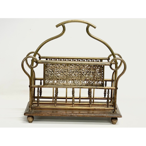 138 - A late Victorian brass and oak magazine rack. 38x16x38cm