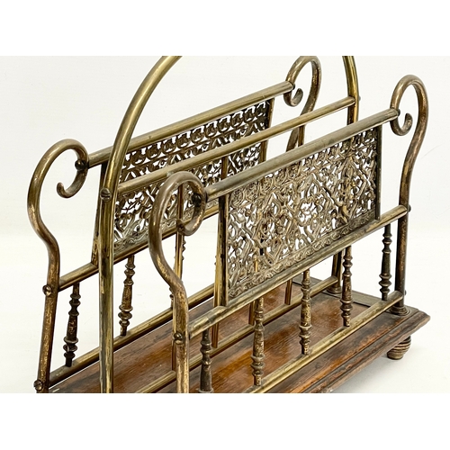 138 - A late Victorian brass and oak magazine rack. 38x16x38cm