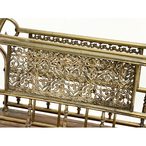 138 - A late Victorian brass and oak magazine rack. 38x16x38cm