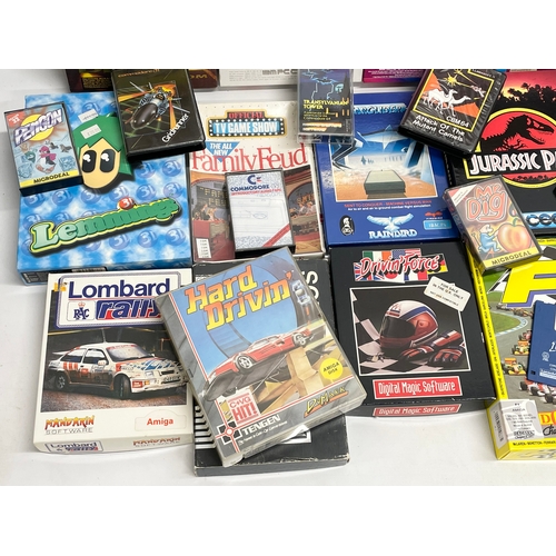 445 - A collection of vintage computer games with boxes and paperwork.