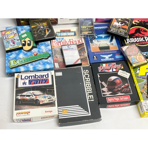 445 - A collection of vintage computer games with boxes and paperwork.