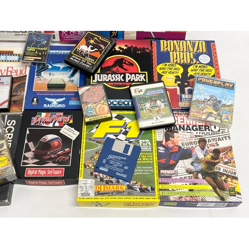 445 - A collection of vintage computer games with boxes and paperwork.