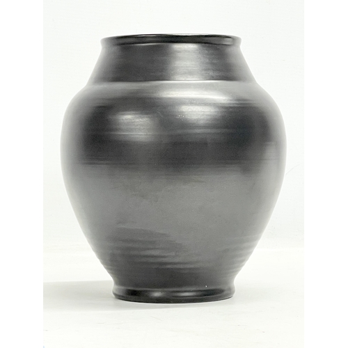 233 - A 1930’s Pilkington's Royal Lancastrian black glazed vase. 20x23cm