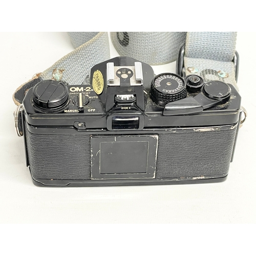 446 - A vintage Olympus OM-2n camera.