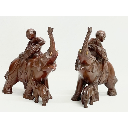 201 - A pair of vintage Chinese Boxwood elephants with riders. 17x20cm