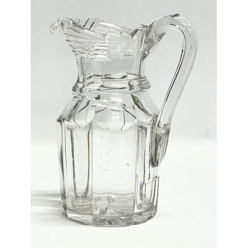 203 - A large Victorian glass jug. 17x23cm