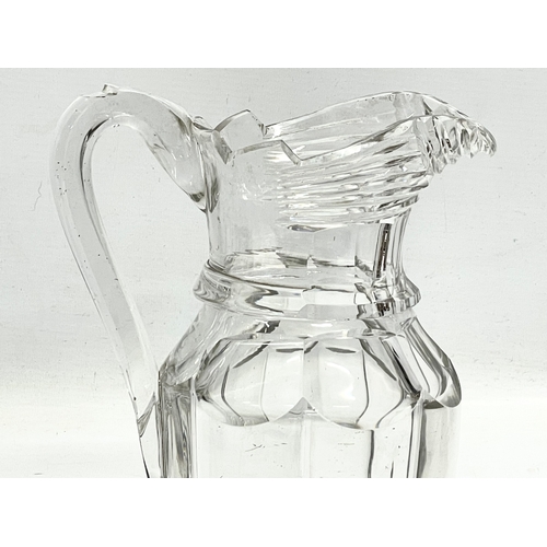 203 - A large Victorian glass jug. 17x23cm