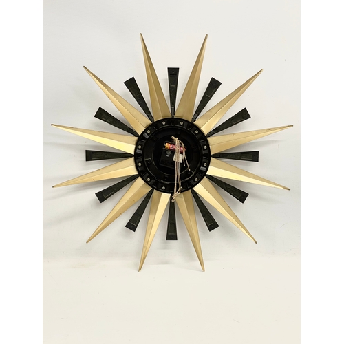 125 - A 1960’s Mid Century ‘Sunburst’ wall clock. By Metamec. 60cm