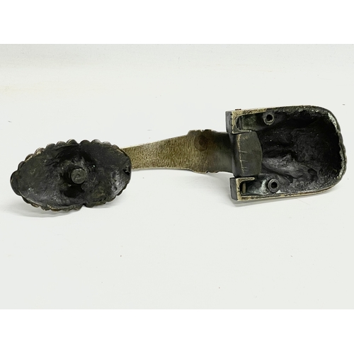 205 - A Victorian brass Egyptian Revival door knocker. 25cm