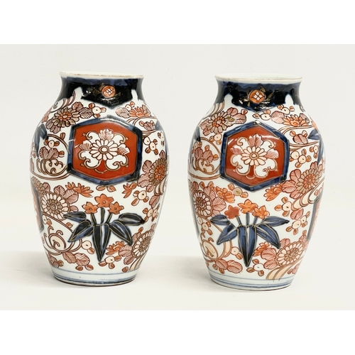 141 - A pair of late 19th century Japanese Imari pattern vases. Makers stamp on bottom. 10x15cm