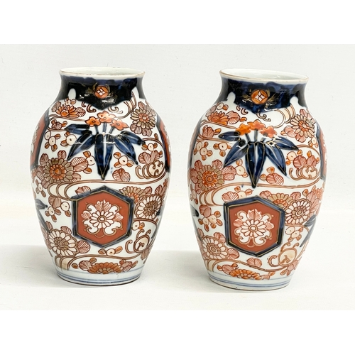 141 - A pair of late 19th century Japanese Imari pattern vases. Makers stamp on bottom. 10x15cm