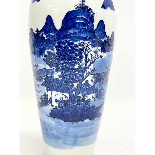 142 - A 19th century Chinese blue and white landscape vase. 30.5cm