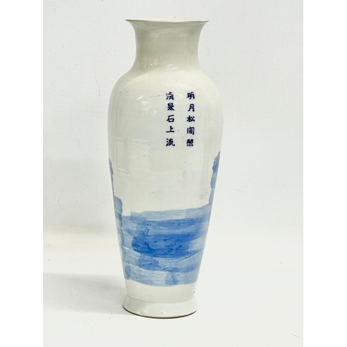 142 - A 19th century Chinese blue and white landscape vase. 30.5cm