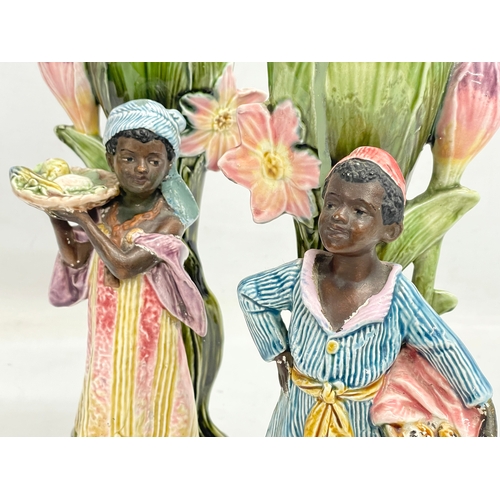 157 - A pair of late 19th century French Barbotine Majolica figures. 6614. 30cm