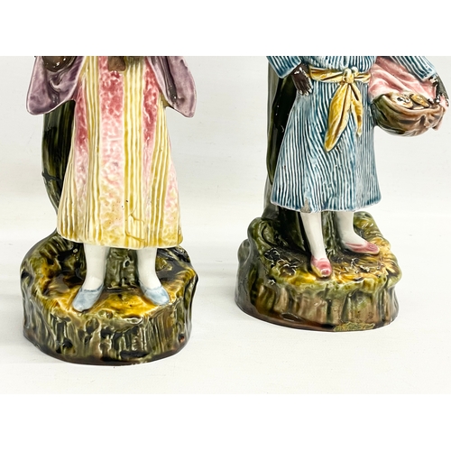 157 - A pair of late 19th century French Barbotine Majolica figures. 6614. 30cm