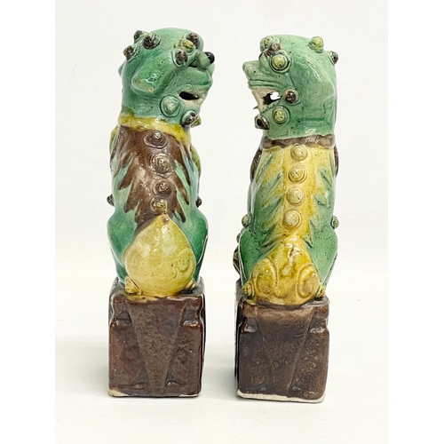 145 - A pair of late 19th Chinese Sancai Glazed porcelain dogs. 16cm.