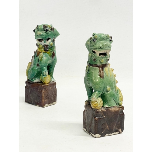 145 - A pair of late 19th Chinese Sancai Glazed porcelain dogs. 16cm.