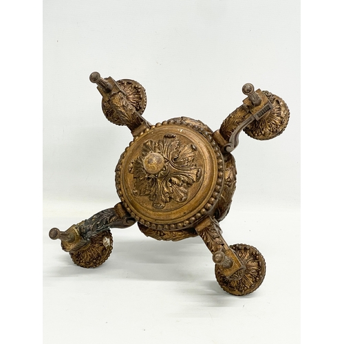 161 - An early 20th century gilt ceiling candleholder. 32x32x38cm