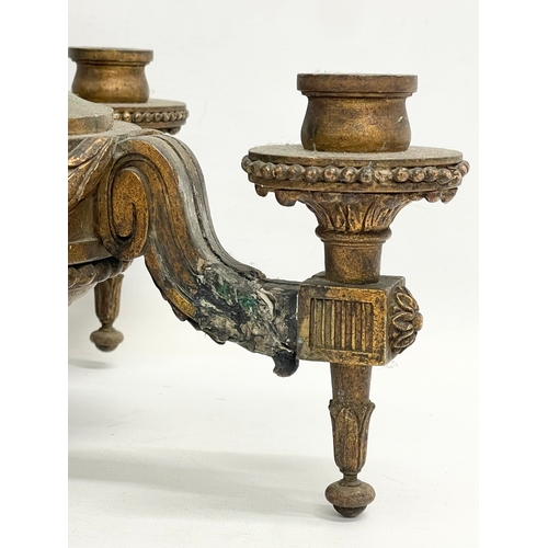 161 - An early 20th century gilt ceiling candleholder. 32x32x38cm