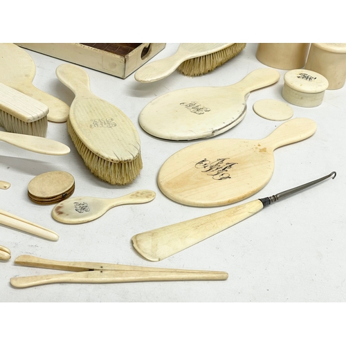 496 - A collection of 19th century bone vanity brushes and mirrors etc.