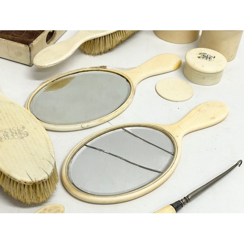 496 - A collection of 19th century bone vanity brushes and mirrors etc.