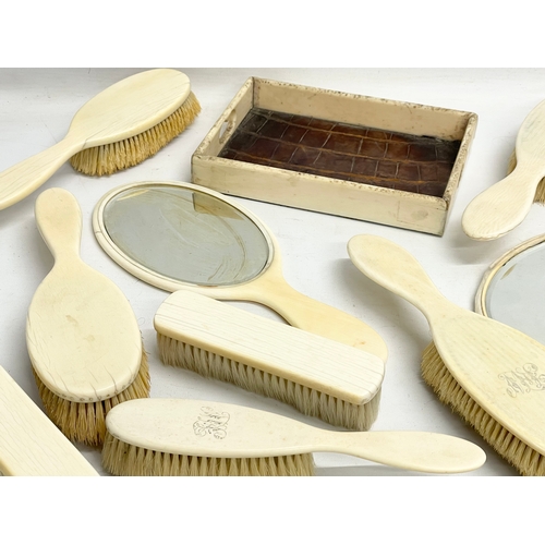 496 - A collection of 19th century bone vanity brushes and mirrors etc.