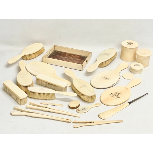 496 - A collection of 19th century bone vanity brushes and mirrors etc.