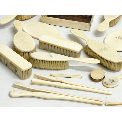 496 - A collection of 19th century bone vanity brushes and mirrors etc.