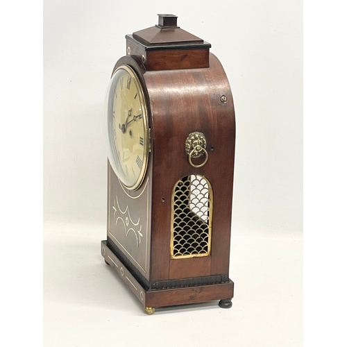 26 - A large Regency mahogany brass inlaid double fusee mantle clock with pendulum. 27x16x50cm