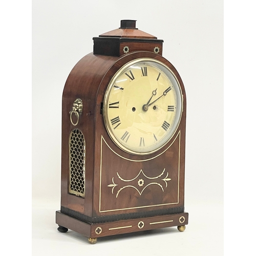 26 - A large Regency mahogany brass inlaid double fusee mantle clock with pendulum. 27x16x50cm