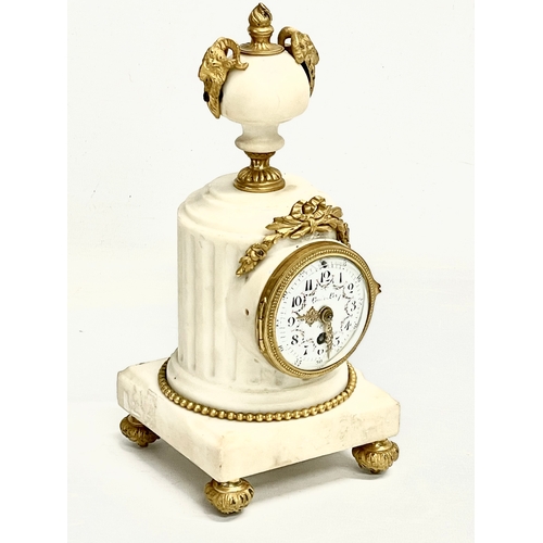 236 - A late 19th century French marble mantle clock with brass mounts and enamel face. 11x11x23.5cm