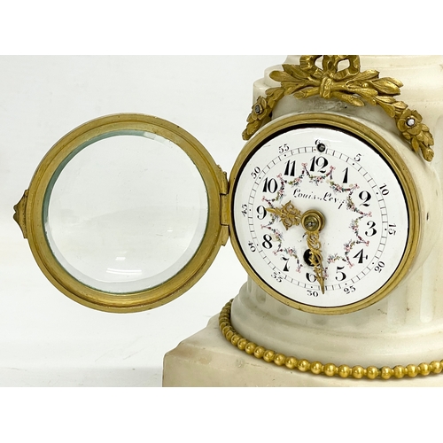 236 - A late 19th century French marble mantle clock with brass mounts and enamel face. 11x11x23.5cm