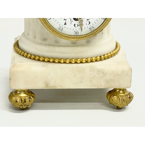 236 - A late 19th century French marble mantle clock with brass mounts and enamel face. 11x11x23.5cm